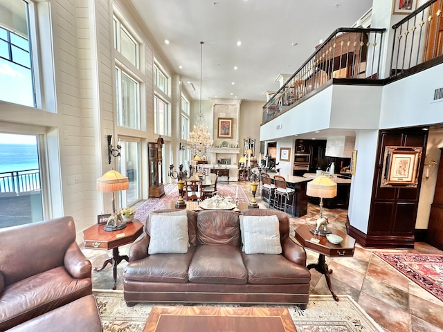 tiled living room featuring a high ceiling and a fireplace