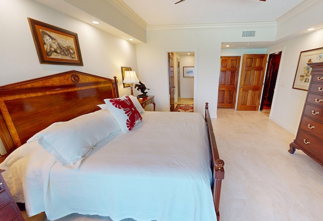 bedroom featuring ornamental molding and connected bathroom