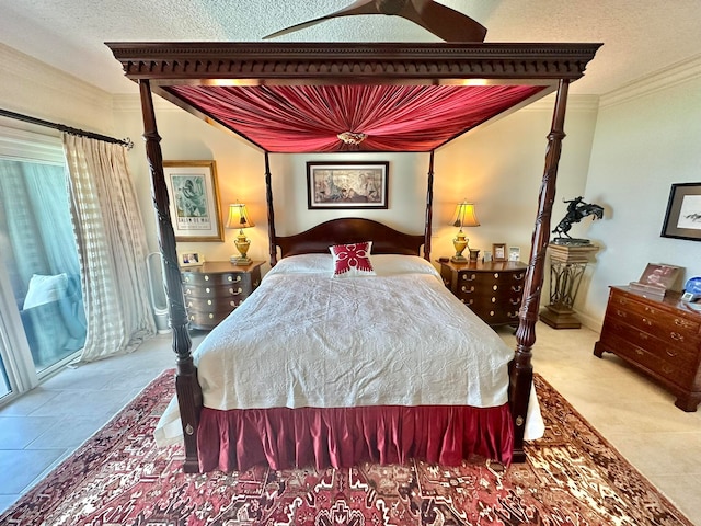 bedroom with crown molding, a textured ceiling, and tile patterned floors