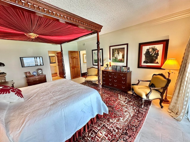 bedroom with a textured ceiling and ornamental molding