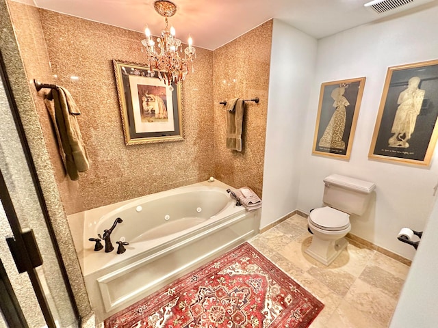 bathroom with a tub to relax in, an inviting chandelier, and toilet