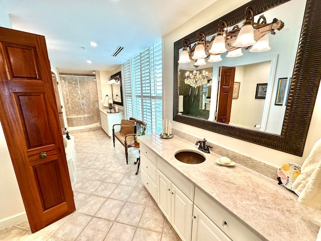 bathroom featuring a shower with door, a chandelier, tile patterned flooring, and vanity