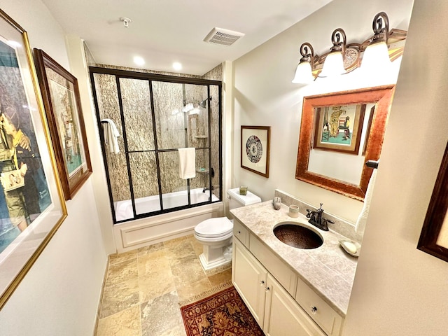 full bathroom with vanity, enclosed tub / shower combo, and toilet