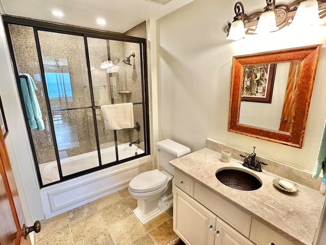 full bathroom with bath / shower combo with glass door, vanity, and toilet