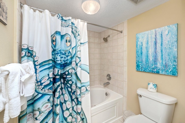 bathroom featuring shower / bath combo, a textured ceiling, and toilet