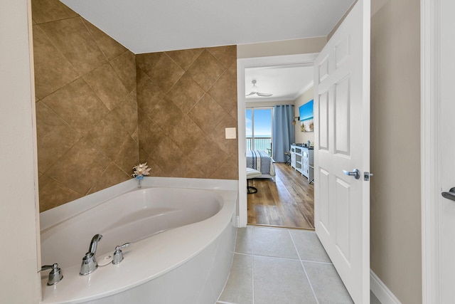 bathroom featuring tile patterned flooring and a bathtub