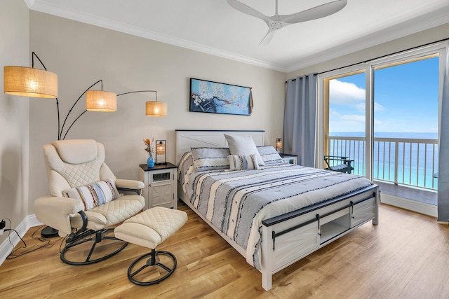 bedroom with a water view, crown molding, access to outside, light wood-type flooring, and ceiling fan