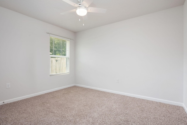 empty room featuring ceiling fan and carpet flooring