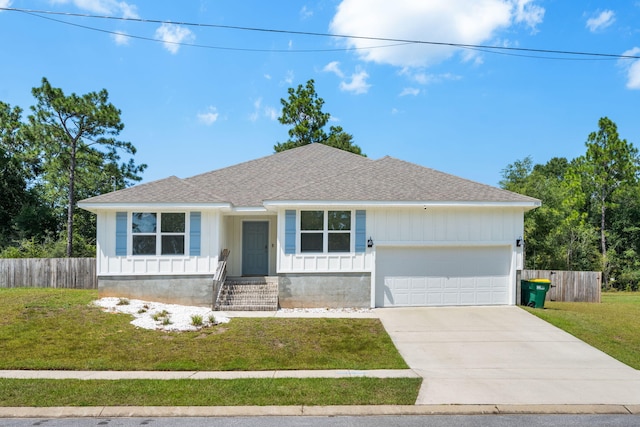 ranch-style home featuring a garage and a front lawn