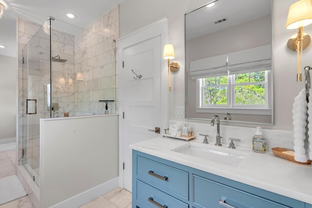 full bath with marble finish floor, vanity, visible vents, and a stall shower