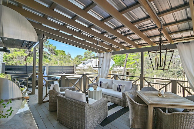 wooden terrace with outdoor lounge area