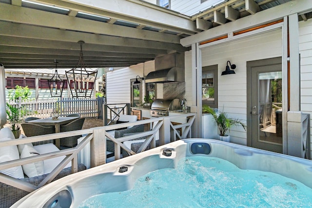 view of patio / terrace with a hot tub and area for grilling