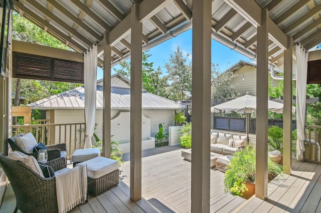 wooden deck featuring fence and an outdoor hangout area