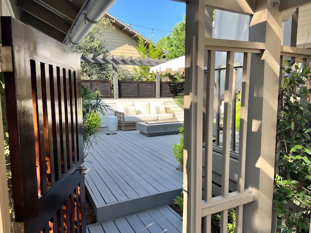 deck with fence and a pergola