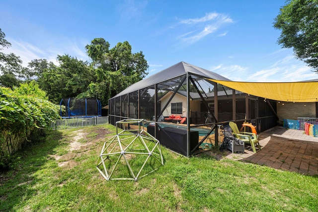 view of yard featuring a lanai, a pool, a patio, and a trampoline