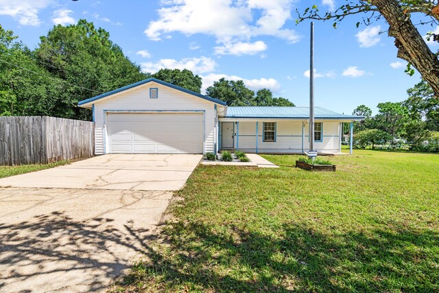 ranch-style house with a garage and a front yard