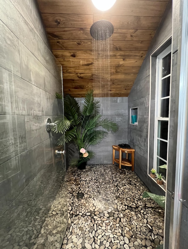 bathroom featuring tile patterned floors, wooden ceiling, wooden walls, and lofted ceiling