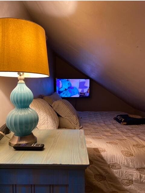 bedroom with lofted ceiling