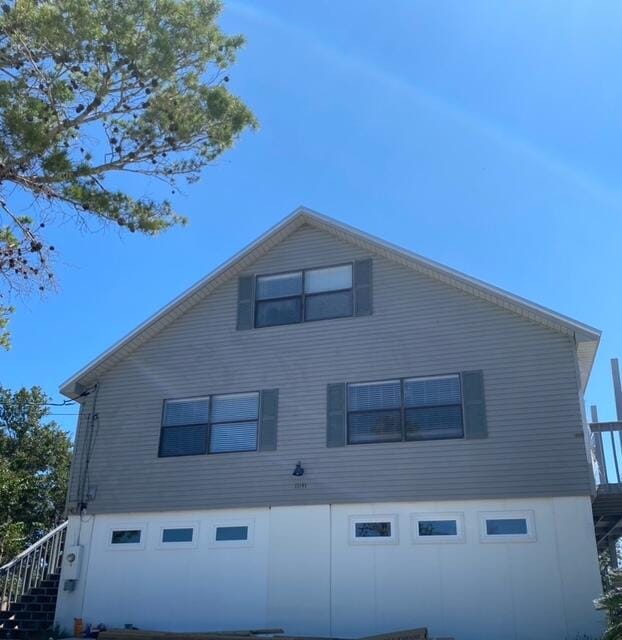 back of property featuring a garage