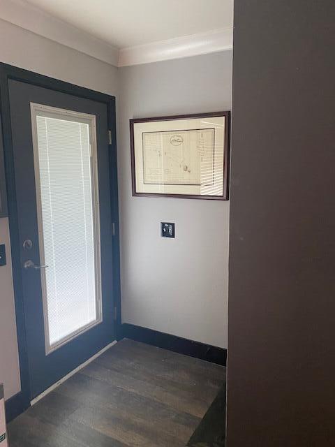 interior space featuring crown molding and hardwood / wood-style floors