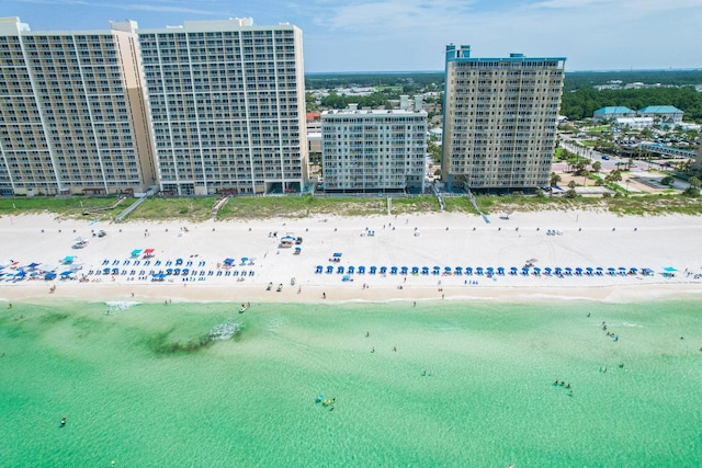 bird's eye view featuring a view of the beach and a water view
