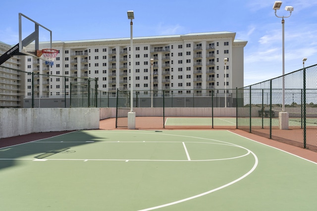 view of sport court with community basketball court and fence