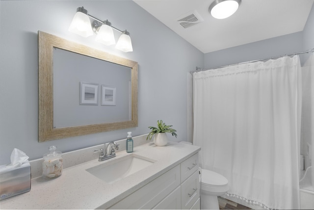 bathroom with vanity, a shower with curtain, and toilet