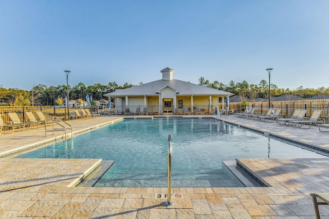 view of swimming pool with a patio area