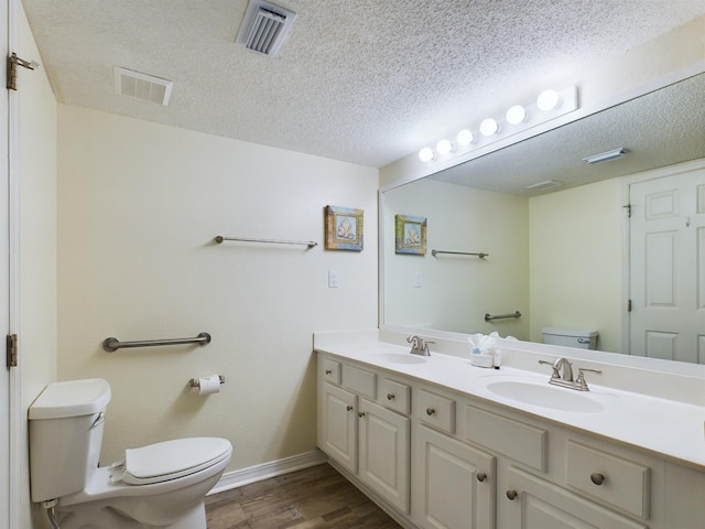 790 Santa Rosa Blvd Unit 3009, Fort Walton Beach, FL 32548 - full bath featuring toilet, a sink, a textured ceiling, and visible vents