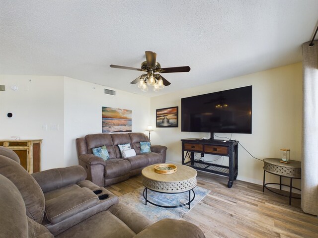 790 Santa Rosa Blvd Unit 3009, Fort Walton Beach, FL 32548 - living room with visible vents, wood finished floors, ceiling fan, and a textured ceiling