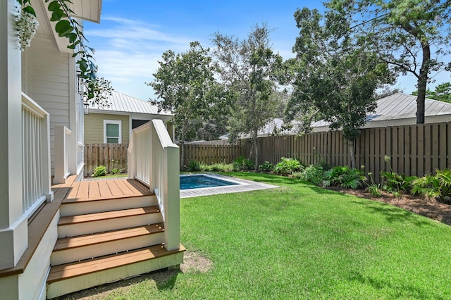 view of yard with a fenced in pool