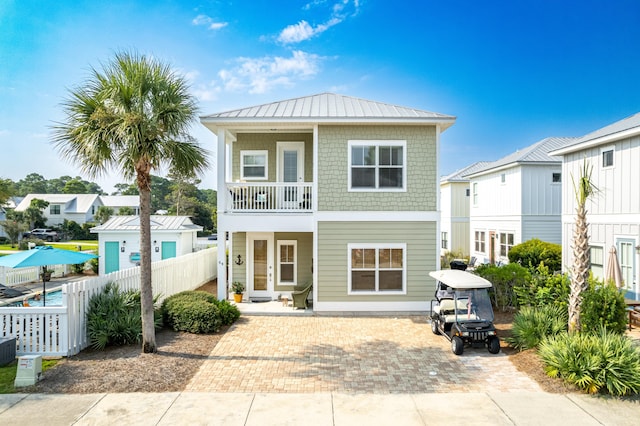 view of front of home with a balcony