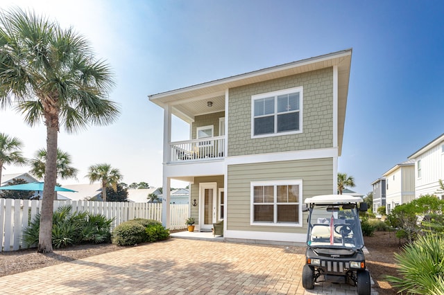 rear view of property with a balcony