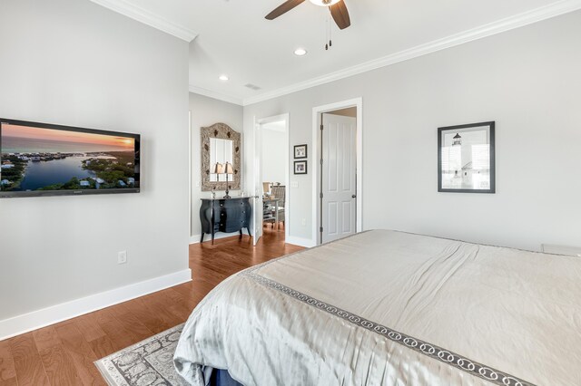 bedroom with ceiling fan, wood-type flooring, and ornamental molding