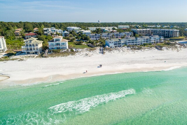 drone / aerial view with a water view and a view of the beach