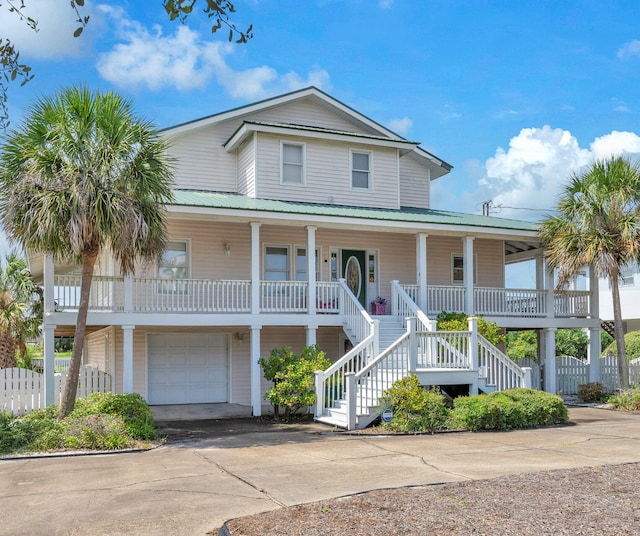 view of front of home with a garage and covered porch