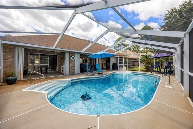 view of pool featuring a lanai and a patio