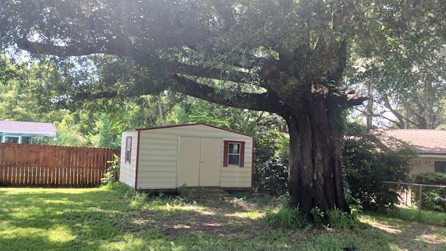 view of shed with fence