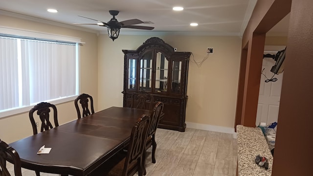 dining area with a ceiling fan, baseboards, light wood-style flooring, recessed lighting, and crown molding