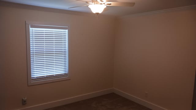 empty room featuring carpet flooring, a ceiling fan, crown molding, and baseboards