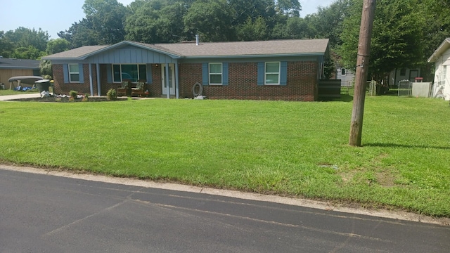 111 NW Sotir St, Fort Walton Beach, FL 32548 - ranch-style house featuring brick siding and a front yard
