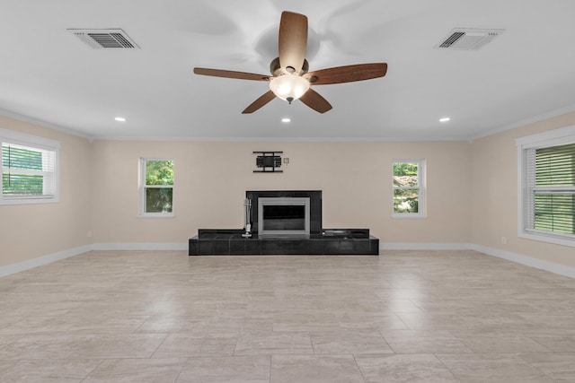 111 NW Sotir St, Fort Walton Beach, FL 32548 - unfurnished living room featuring crown molding, visible vents, and plenty of natural light