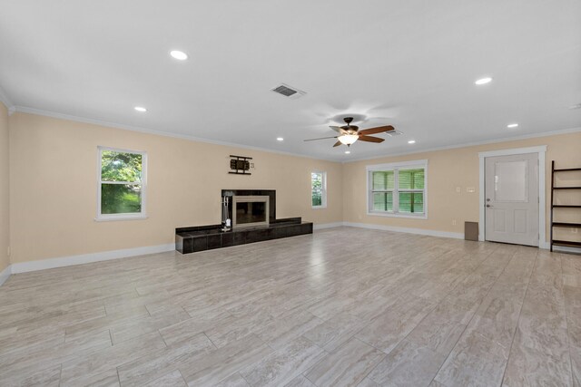 111 NW Sotir St, Fort Walton Beach, FL 32548 - unfurnished living room featuring ornamental molding, baseboards, recessed lighting, and plenty of natural light