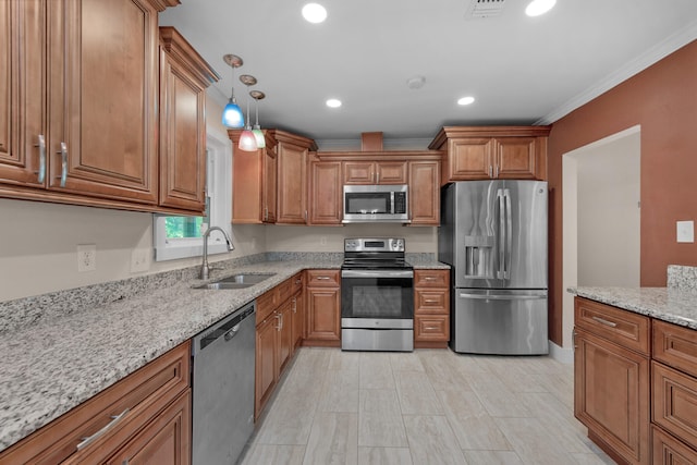 111 NW Sotir St, Fort Walton Beach, FL 32548 - kitchen with light stone countertops, visible vents, brown cabinets, stainless steel appliances, and a sink