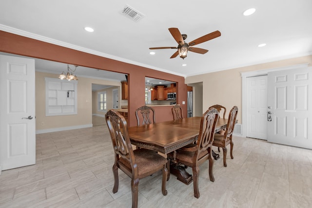 111 NW Sotir St, Fort Walton Beach, FL 32548 - dining space with baseboards, recessed lighting, crown molding, visible vents, and ceiling fan with notable chandelier