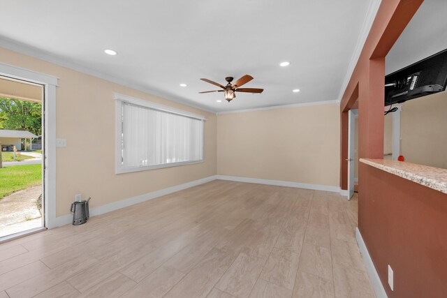 111 NW Sotir St, Fort Walton Beach, FL 32548 - unfurnished living room featuring crown molding, ceiling fan, light wood-type flooring, recessed lighting, and baseboards