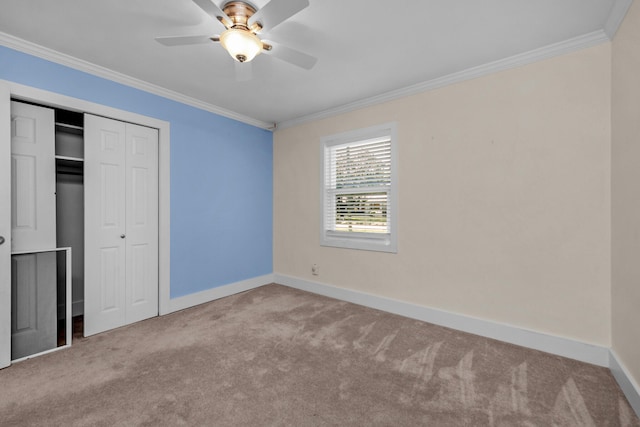111 NW Sotir St, Fort Walton Beach, FL 32548 - unfurnished bedroom with a closet, baseboards, ornamental molding, a ceiling fan, and carpet floors