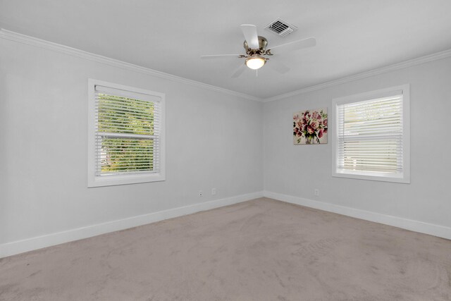 111 NW Sotir St, Fort Walton Beach, FL 32548 - spare room featuring ornamental molding, visible vents, plenty of natural light, and carpet floors