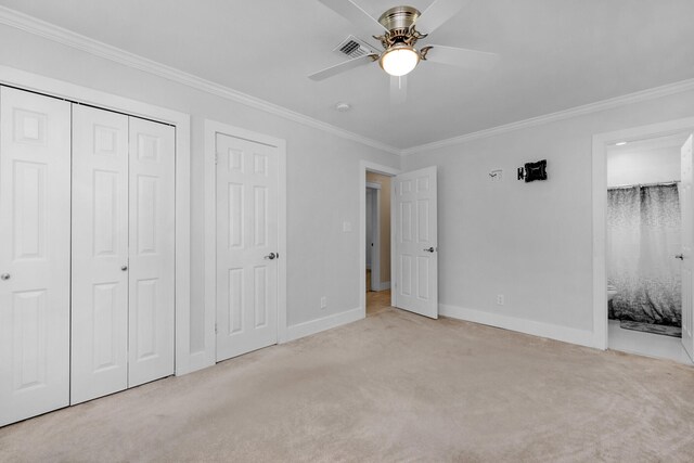 111 NW Sotir St, Fort Walton Beach, FL 32548 - unfurnished bedroom featuring baseboards, ornamental molding, connected bathroom, carpet floors, and visible vents