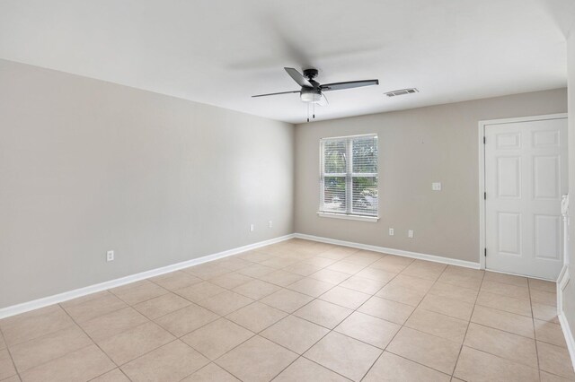 unfurnished room featuring light tile patterned flooring and ceiling fan